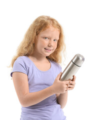 Little redhead girl with thermos on white background