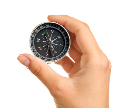 Woman with compass on white background, closeup