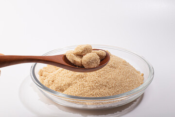 brown sugar heap and wooden spoon