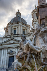 Fototapeta na wymiar Sant'Agnese in Agone in Piazza Navona. Historic Landmark in Rome, Italy. Cloudy Sky.