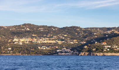 Fototapeta premium Rocky Coast and Homes near Touristic Town, Sorrento, Italy. Amalfi Coast. Sunny Evening