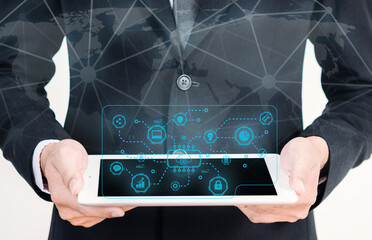 Businessman holding digital tablet with network virtual screen