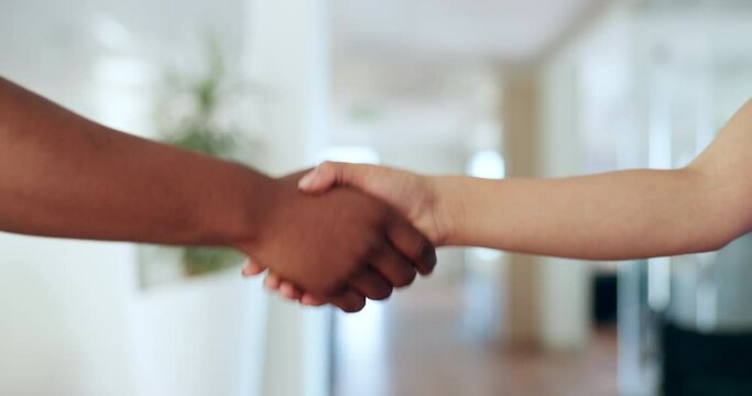 Hospital, nurse and patient shaking hands for greeting, partnership or agreement after a consultation. Handshake, healthcare and medical professional with a woman at an appointment in medicare clinic