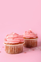 Tasty cupcakes for Valentine's Day on pink background