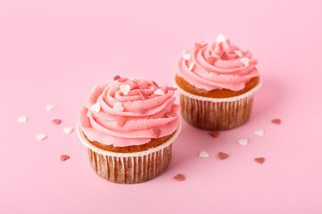 Tasty cupcakes for Valentine's Day on pink background