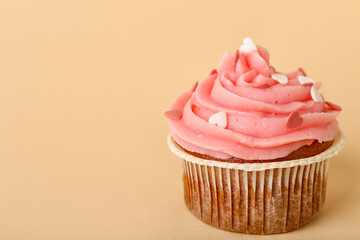Tasty cupcake for Valentine's Day on beige background