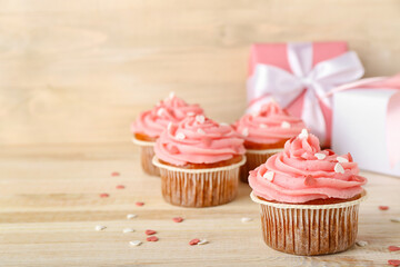 Tasty cupcake for Valentine's Day on wooden background, closeup