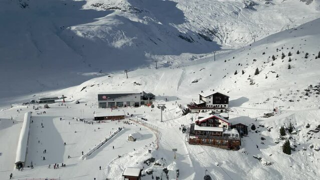 Busy Ski Resort in Belalp in the Canton of Valais in Switzerland. The ski lifts and chairlifts are in operation and skiers are descending the slopes