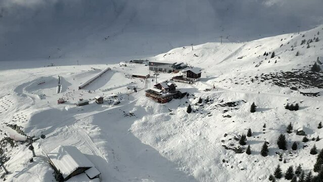 Top station of a ski resort Belalp in Switzerland. The ski lifts are in operation and the cable car brings skiers to the resort