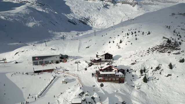 Busy ski resort in Belalp in the canton of Valais in Switzerland. The ski lifts and chairlifts are in operation and skiers are on the slopes