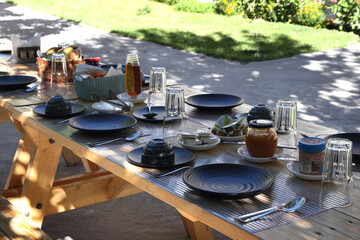 Fototapeta na wymiar Ready breakfast table in outdoor location.