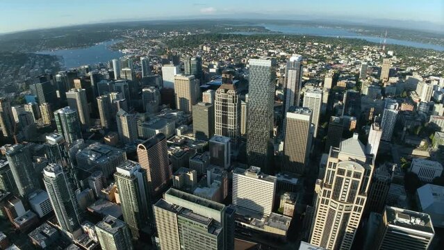 High up aerial view of downtown Seattle's skyscrapers on a warm summer day.