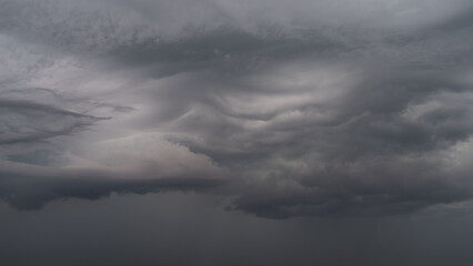 Obraz premium Detail shot of epic storm clouds during sunrise