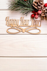 Happy new year on wooden white background