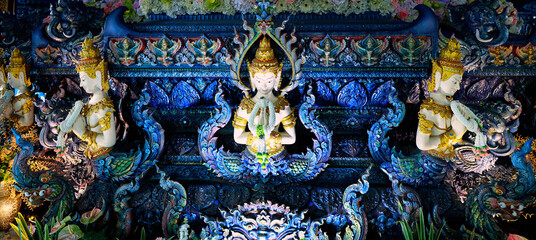 Detail of sculpture in Wat Rong Suea Ten, Temple of the Dancing Tiger, in the blue buddhist temple -Chiang Rai-Thailand