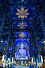 Fototapeta premium Wat Rong Suea Ten, Temple of the Dancing Tiger,white statue of buddha, in the blue buddhist temple -Chiang Rai-Thailand