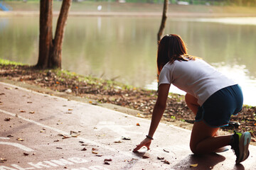 Woman runner running through the park. Young girl running.
