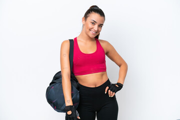 Obraz premium Young sport woman with sport bag isolated on white background laughing