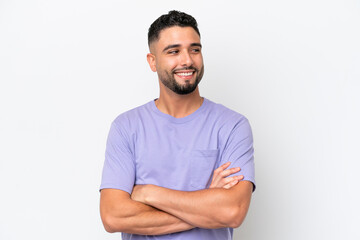 Young Arab handsome man isolated on white background looking to the side and smiling