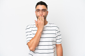 Young Arab handsome man isolated on white background covering mouth with hand