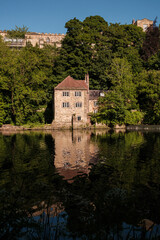 Fototapeta na wymiar Durham England: 2022-06-07: The Old Fulling Mill on the River Wear in Durham city near cathedral