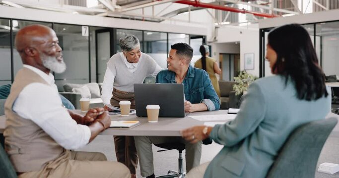 Business people, diversity and meeting at desk with laptop for planning, vision and strategy with team. Group, teamwork or business meeting with handshake, computer or discussion for marketing at job