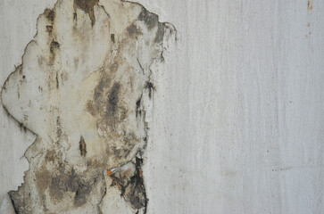 Closeup of peeling painted old wall with copy space