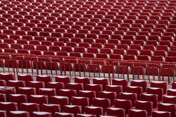 Row of Empty seats of tribune on sport stadium. Concept of fans. Chairs for audience. Empty seats, modern stadium.