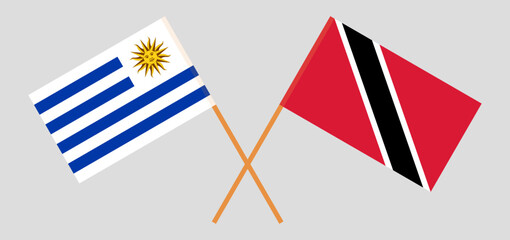 Crossed flags of Uruguay and Trinidad and Tobago. Official colors. Correct proportion