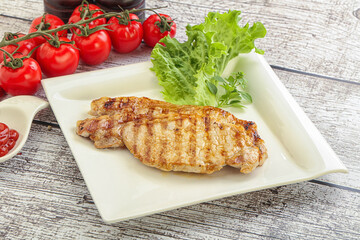 Grilled pork steak with ketchup