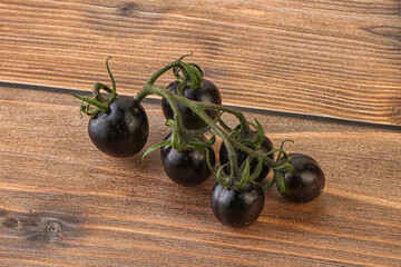 Ripe tasty black cherry tomato