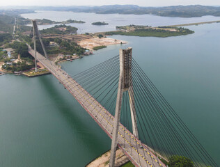 Fototapeta premium Aerial view of Barelang Bridge, a landmark and iconic bridge in Batam, Riau Islands, Indonesia