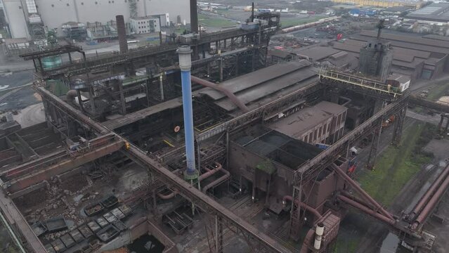 Blast furnice and industrial recycling company. Sintering, zinc production, furnace and casting. Steel industry factory plant. Aerial drone overhead view. Heavy industry in Germany.
