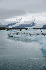 Many icebergs and ice floes in the glacial lagoon jökulsárlón in iceland, which has broken away...