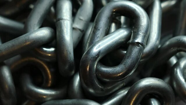 silver metal chain rotates in a circle