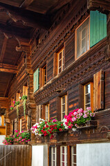 Fototapeta na wymiar Old traditional hause in Village in Swiss Alps