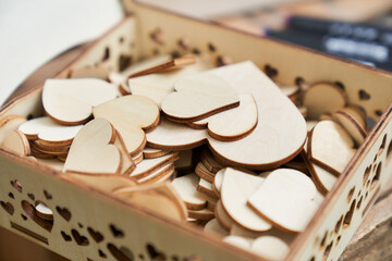 a wooden box filled with wooden hearts