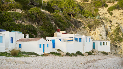 Fototapeta na wymiar white fishermen houses on a pebble beach