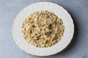 Traditional delicious Turkish food; rice pilaf with pine nuts and currants (Turkish name; ic pilav...