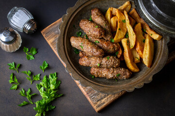 Traditional Turkish food; dry meatballs or inegöl meatballs with potatoes (Turkish name; Kuru kofte or anne koftesi)