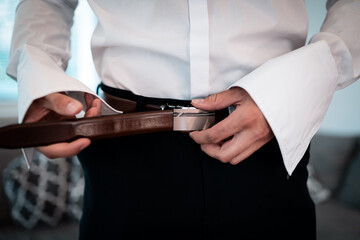 wedding day,dressing and preparing  the groom for the wedding ceremony