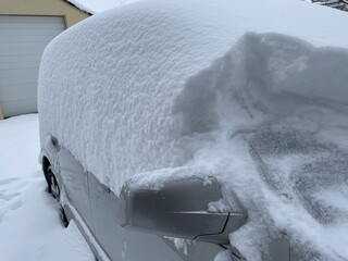snow covered car in winter