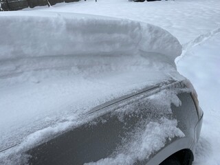 snow covered car in winter