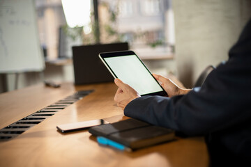 Close up of man using digital tablet