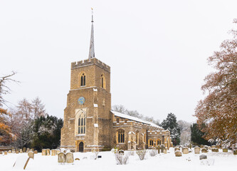 Traditional English village church covered in Snow. St Andrews Church, Much Hadham, Hertfordshire. UK