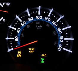 Dial indication 4x4 low is on and traction control off - 557369383