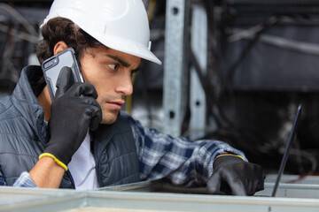 builder on cell phone in the ceiling