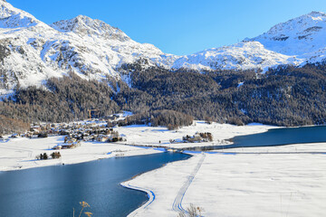 Silvaplana lake in winter from high view to Piz Corvatsch in Engadine in Switzerland
