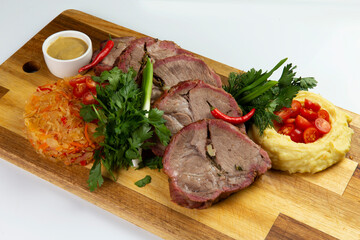 Cooked tenderloin meat and mashed potatoes