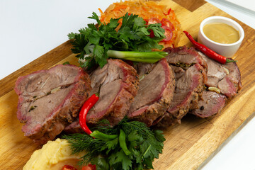 Cooked tenderloin meat and mashed potatoes